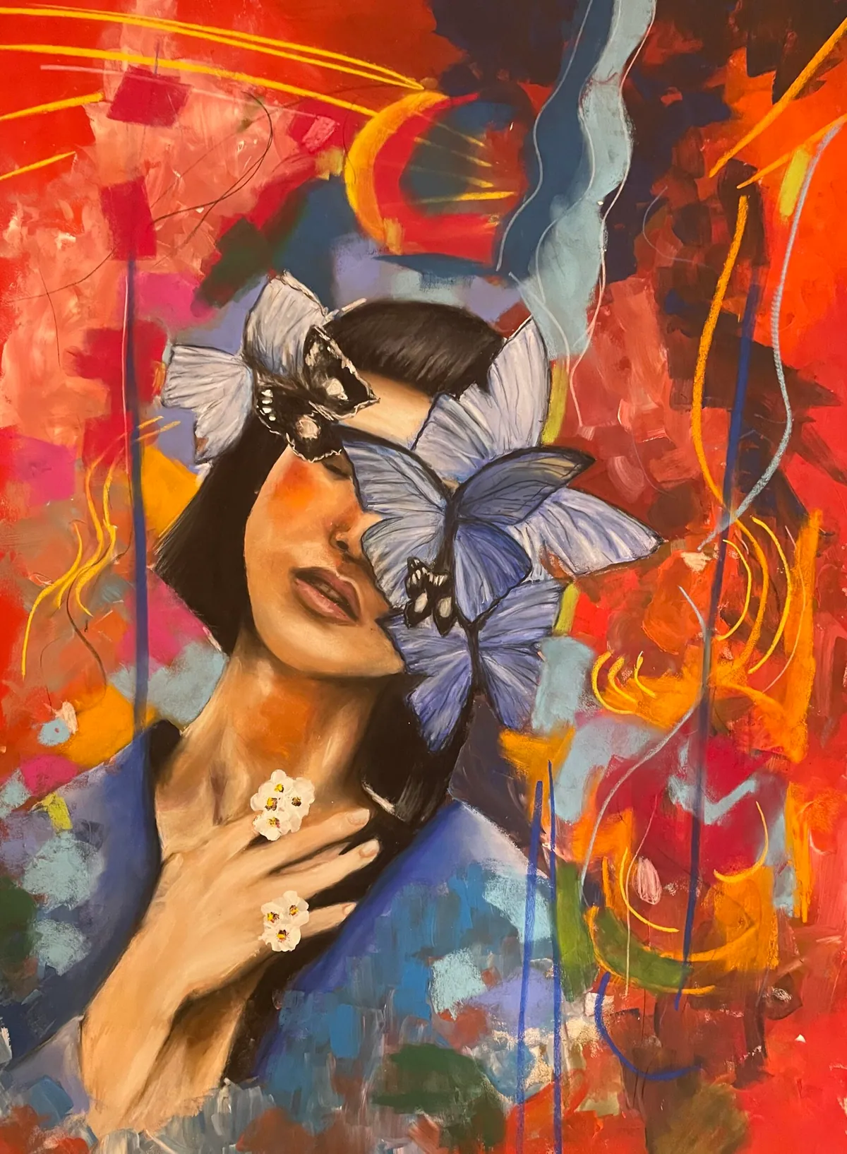 Woman with pale blue butterflies covering one eye, hand at her chest, on a vivid red and orange abstract ground.