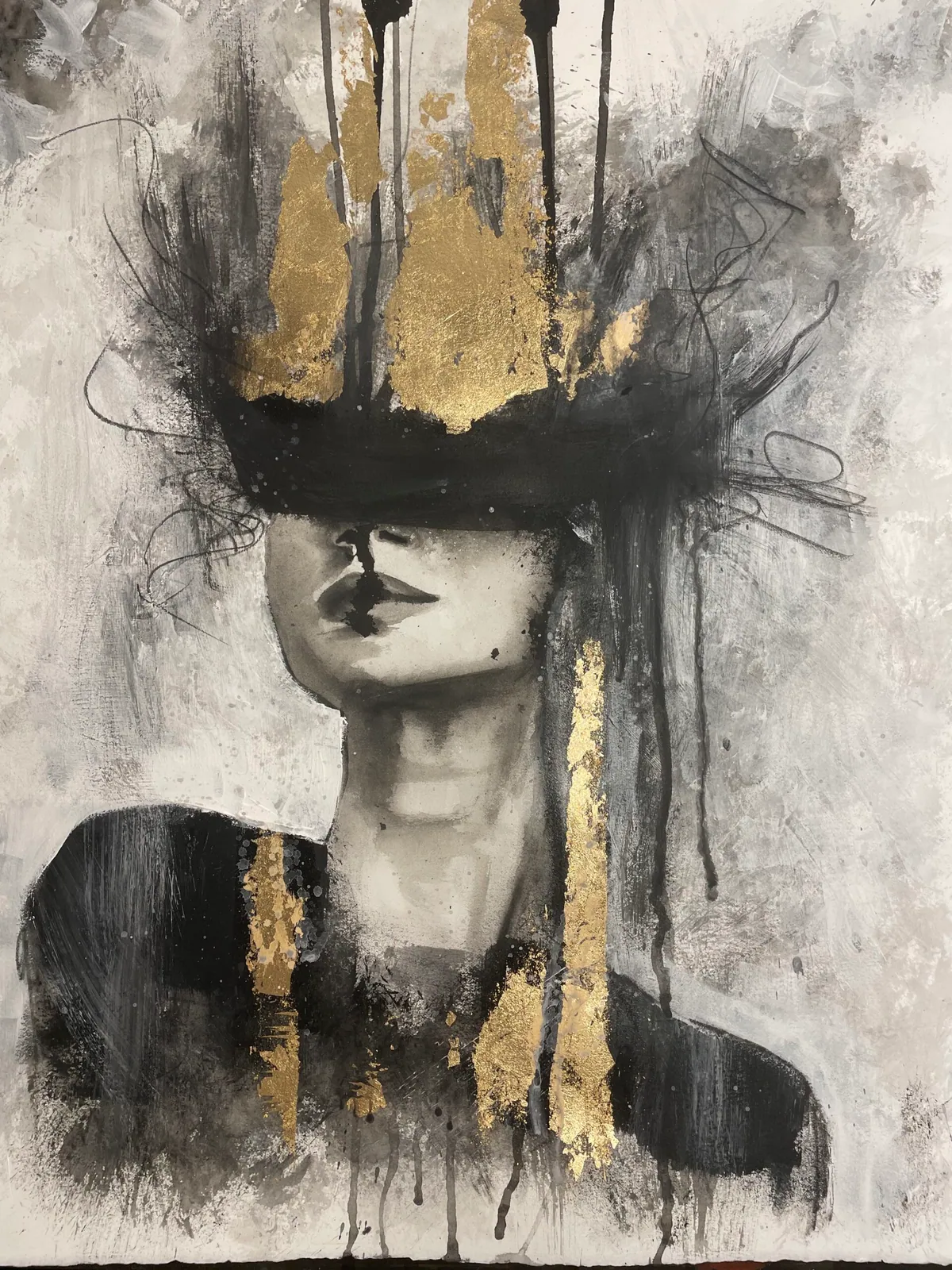 Grey-toned female figure whose eyes are covered by a black band, crowned with gold leaf and dripping paint.
